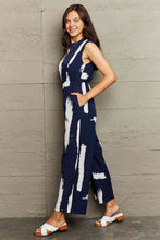 Load image into Gallery viewer, Printed Round Neck Cutout Jumpsuit with Pockets