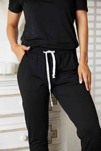Load image into Gallery viewer, Double Take Asymmetrical Neck Tied Jumpsuit with Pockets