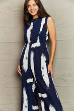 Load image into Gallery viewer, Printed Round Neck Cutout Jumpsuit with Pockets