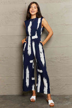 Load image into Gallery viewer, Printed Round Neck Cutout Jumpsuit with Pockets